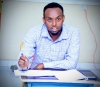 A student reacting to questions from the panelists, at Amoud University School of Postgraduate Studies and Research (ASPGSR), during the Research Proposal Viva Voce conducted on Monday, January 27th, 2020 at Amoud University School of Postgraduate Studies and Research (ASPGSR), Borama Campus premises.